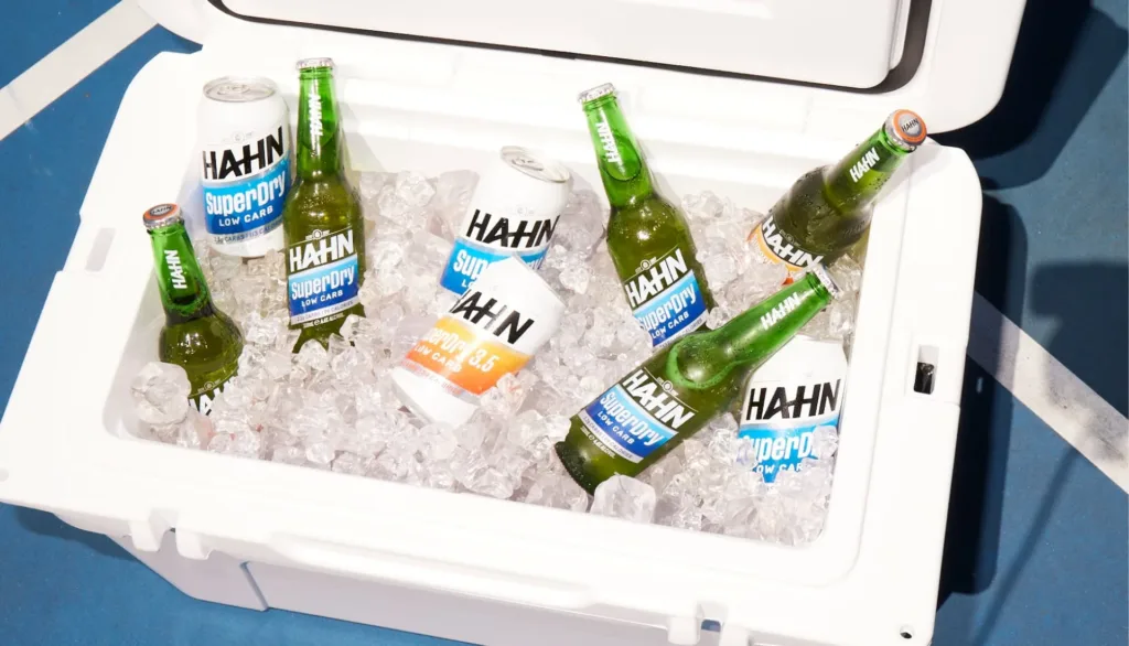 An esky full of ice, bottles and cans of Hahn SuperDry and SuperDry 3.5